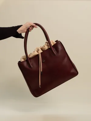 ''...EN SUISSE'' IN BURGUNDY RED (L)